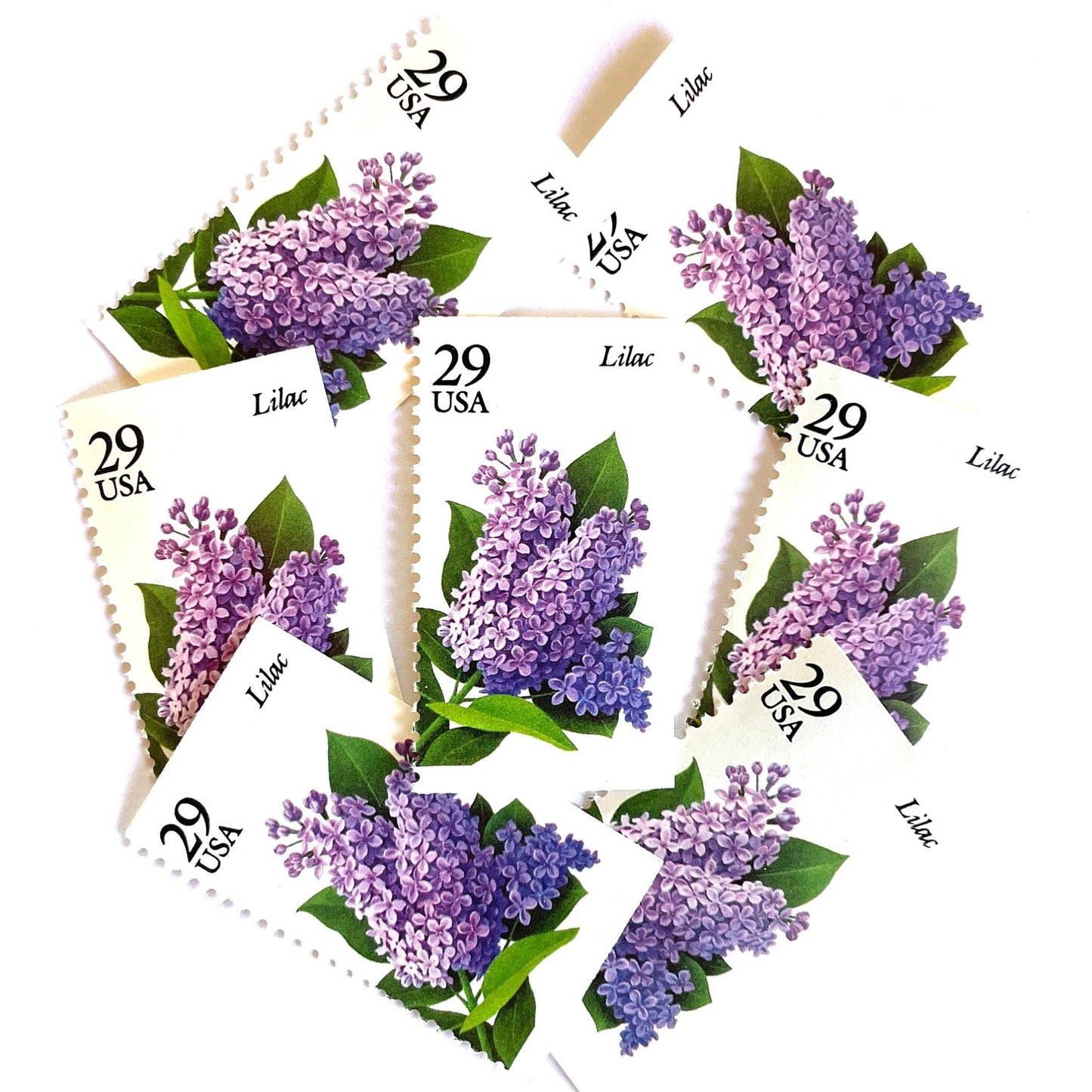 Image of Lilac postage stamps from the Spring Garden Flowers series, featuring purple lilac blossoms with green leaves on vintage 1993 USPS 29-cent postage, Scott 2764.