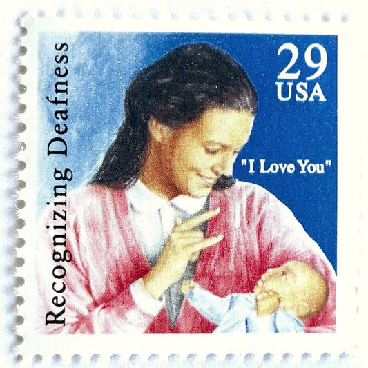 Vintage 1993 American Sign Language Recognizing Deafness postage stamp featuring a mother signing I love you to her baby on unused 29-cent USPS postage, Scott 2783.
