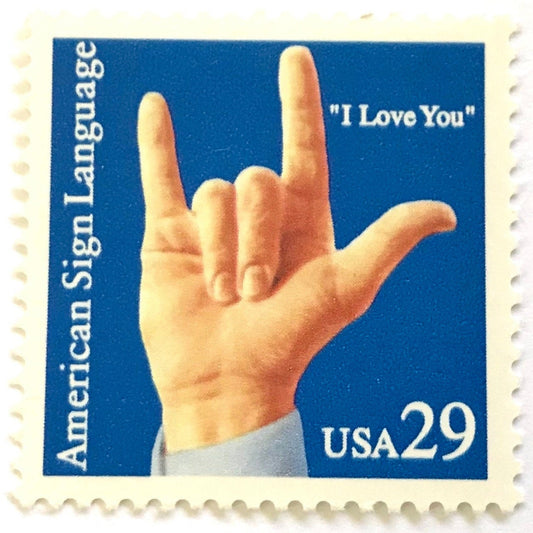Vintage 1993 American Sign Language I Love You postage stamp featuring a hand forming the ASL I love you sign on unused 29-cent USPS postage, Scott 2784.