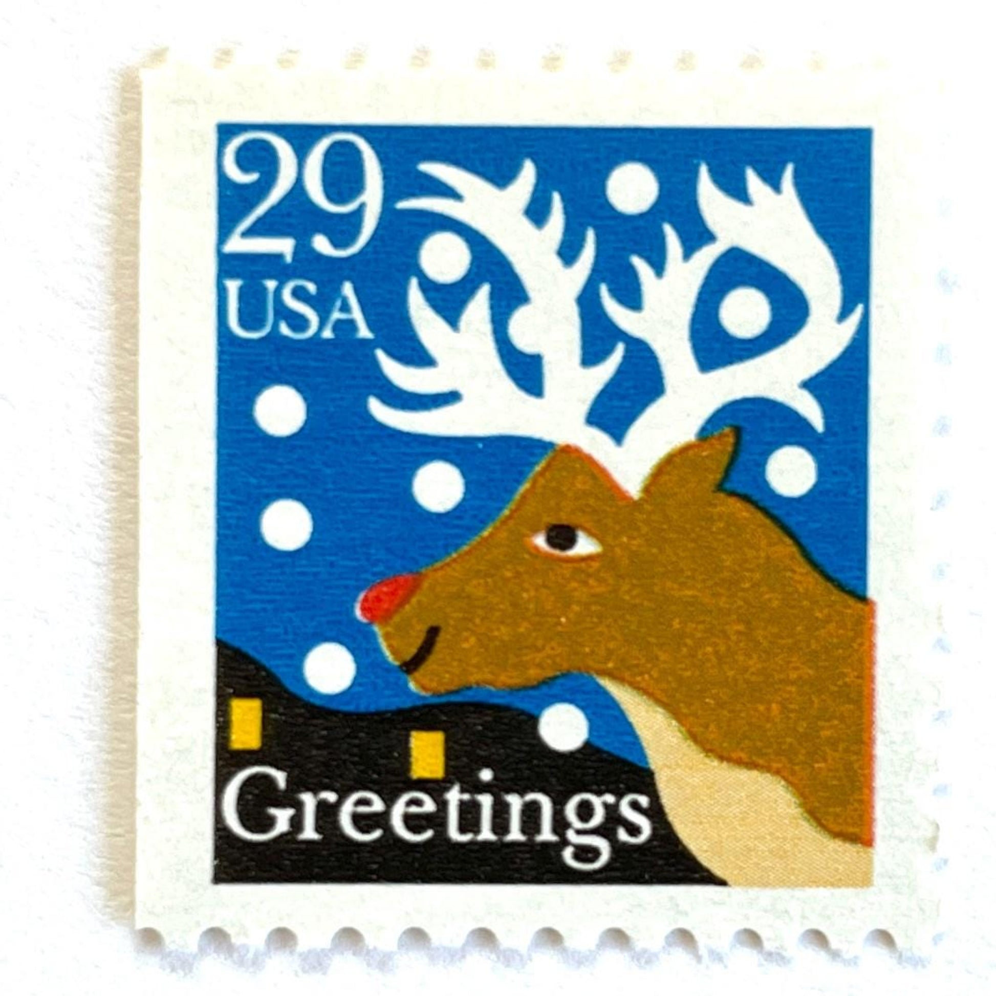 Image of 1993 Contemporary Christmas “Christmas Greetings: Reindeer” 29-cent stamps. Scott #2797. Stamp Themes: Rudolf the Red Nosed Reindeer, Deer, Antlers, Snow, Winter, Christmas, Holidays. Blue, Brown, and White postage stamp.