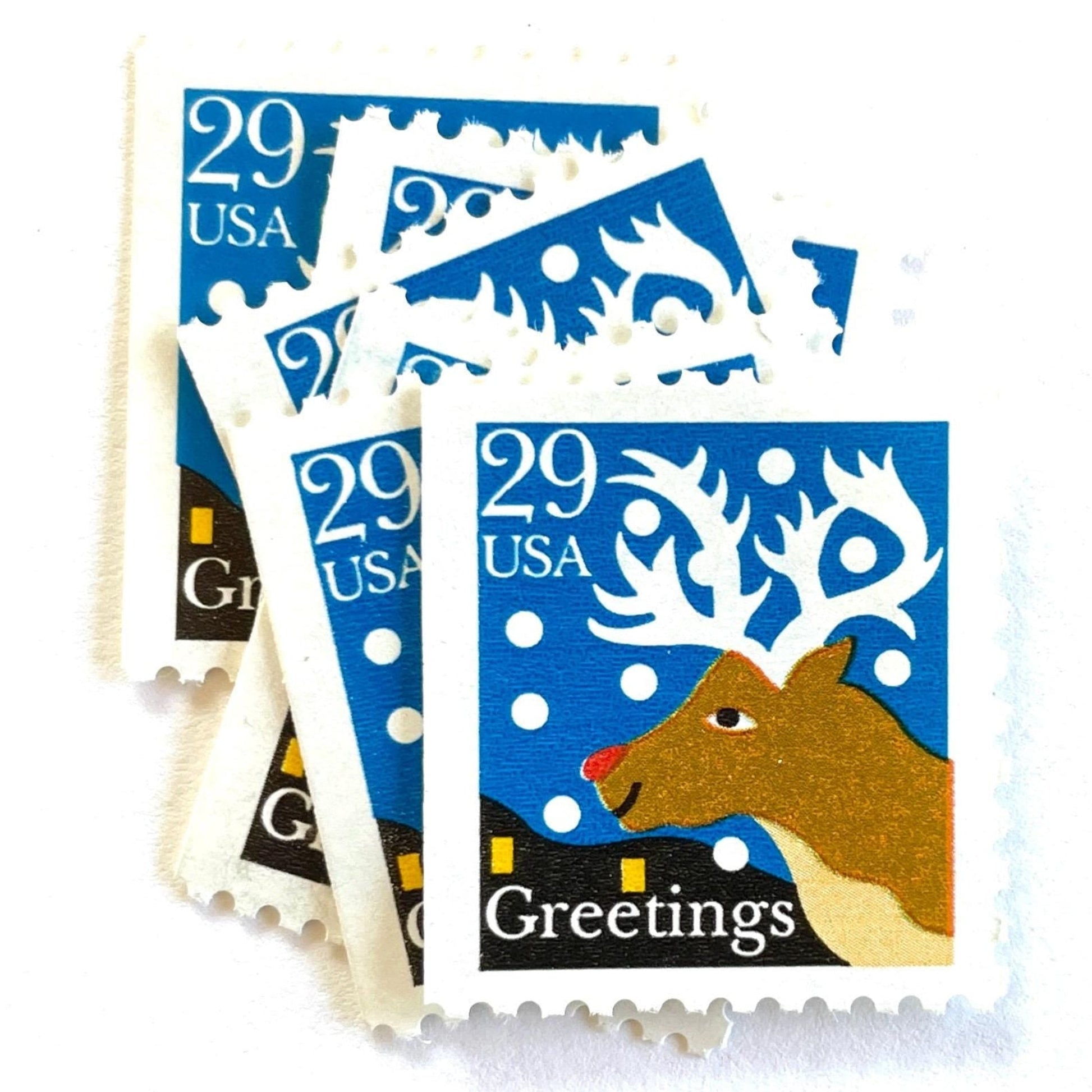 Image of 1993 Contemporary Christmas “Christmas Greetings: Reindeer” 29-cent stamps. Scott #2797. Stamp Themes: Rudolf the Red Nosed Reindeer, Deer, Antlers, Snow, Winter, Christmas, Holidays. Blue, Brown, and White postage stamp.