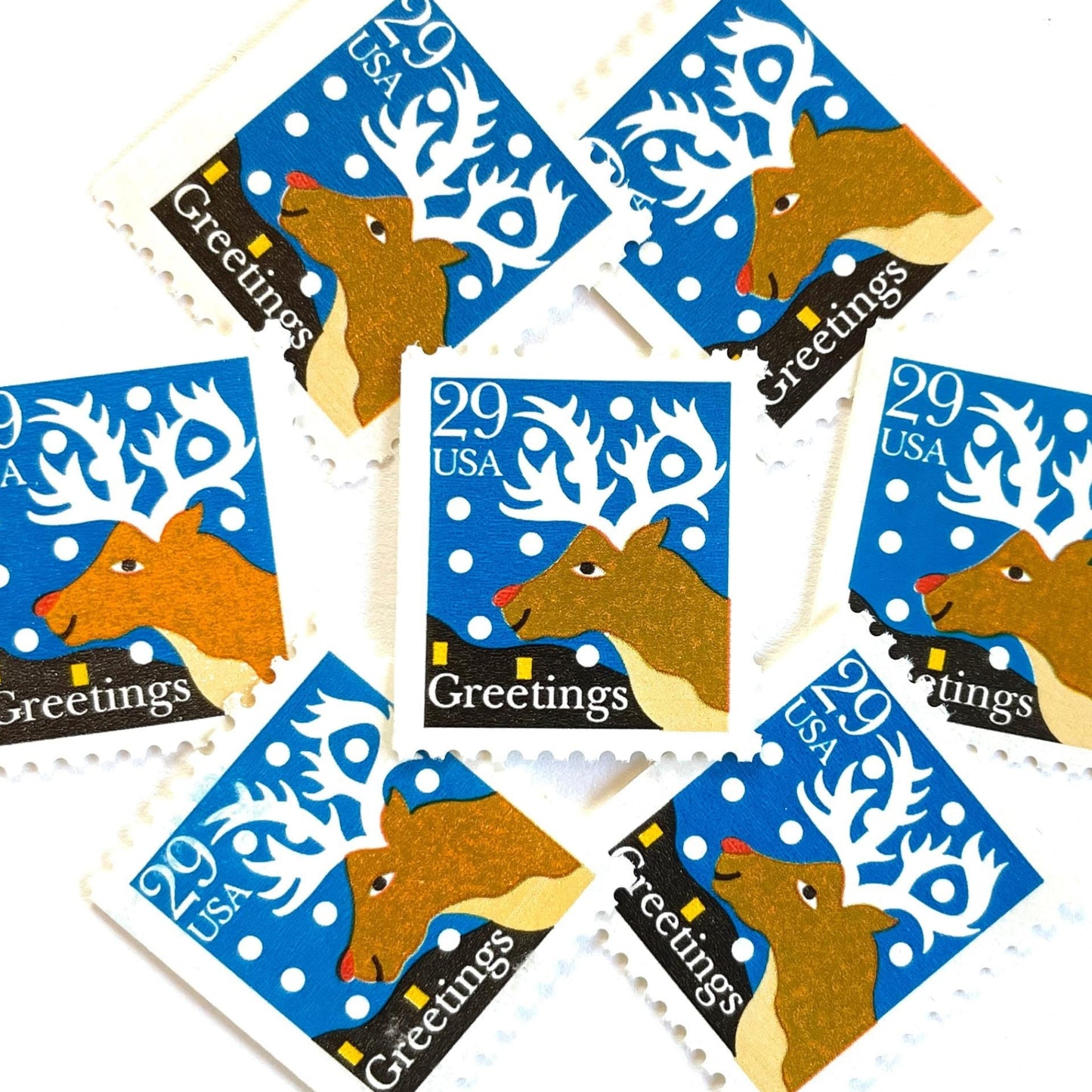 Image of 1993 Contemporary Christmas “Christmas Greetings: Reindeer” 29-cent stamps. Scott #2797. Stamp Themes: Rudolf the Red Nosed Reindeer, Deer, Antlers, Snow, Winter, Christmas, Holidays. Blue, Brown, and White postage stamp.