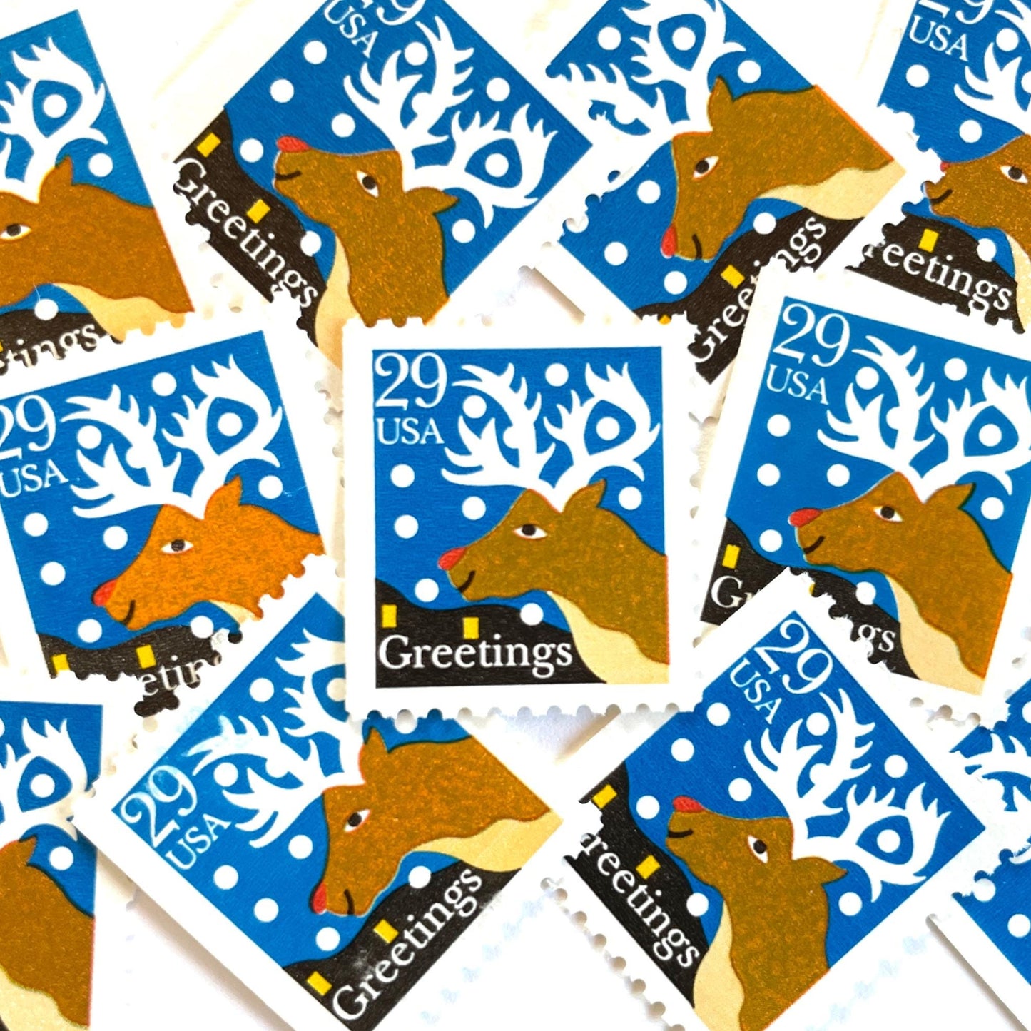 Image of 1993 Contemporary Christmas “Christmas Greetings: Reindeer” 29-cent stamps. Scott #2797. Stamp Themes: Rudolf the Red Nosed Reindeer, Deer, Antlers, Snow, Winter, Christmas, Holidays. Blue, Brown, and White postage stamp.