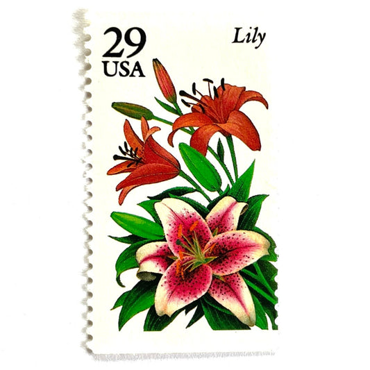 Image of Lily postage stamps from the 1994 Summer Garden Flowers series, featuring pink and red lily blossoms with green foliage on vintage unused 29-cent USPS postage, Scott 2829