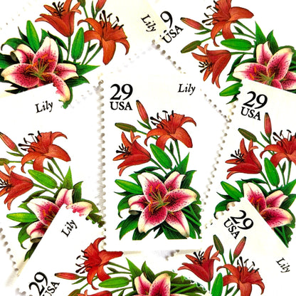 Image of Lily postage stamps from the 1994 Summer Garden Flowers series, featuring pink and red lily blossoms with green foliage on vintage unused 29-cent USPS postage, Scott 2829.