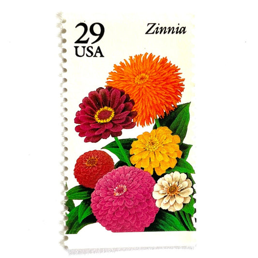 Image of Zinnia postage stamps from the 1994 Summer Garden Flowers series, featuring bright orange, pink, yellow, red, and cream zinnia blooms with green foliage on vintage unused 29-cent USPS postage, Scott 2830.