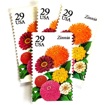 Image of Zinnia postage stamps from the 1994 Summer Garden Flowers series, featuring bright orange, pink, yellow, red, and cream zinnia blooms with green foliage on vintage unused 29-cent USPS postage, Scott 2830.