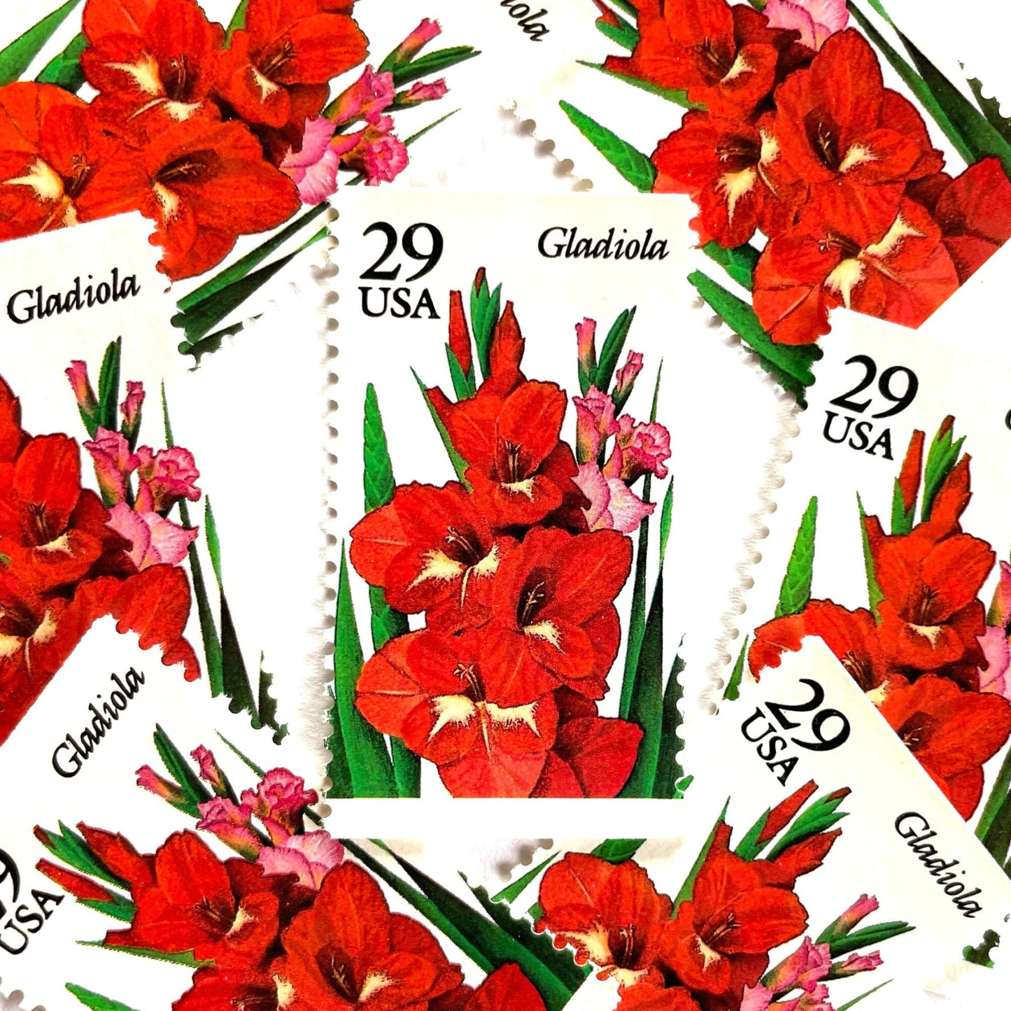 Image of Gladiola postage stamps from the 1994 Summer Garden Flowers series, featuring red-orange gladiola blossoms with green foliage on vintage unused 29-cent USPS postage, Scott 2831.