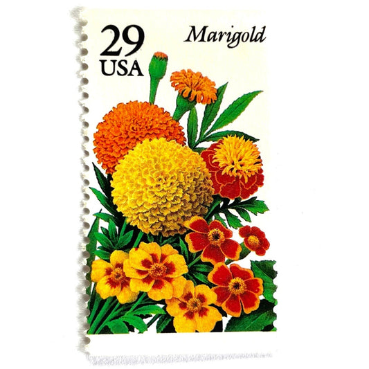 Image of Marigold postage stamps from the 1994 Summer Garden Flowers series, featuring orange, yellow, and red marigold blossoms with green foliage on vintage unused 29-cent USPS postage, Scott 2832