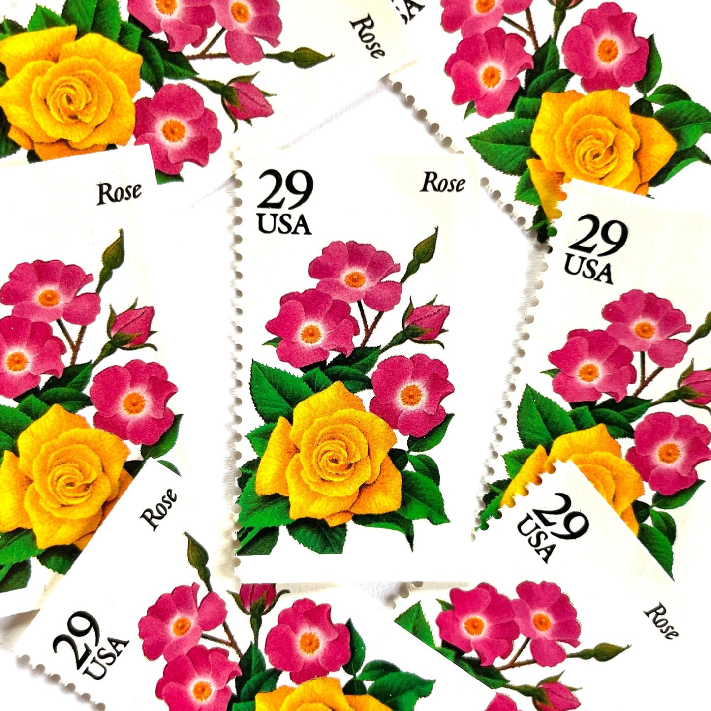 Image of Rose postage stamps from the 1994 Summer Garden Flowers series, featuring a yellow rose with pink blossoms and green foliage on vintage unused 29-cent USPS postage, Scott 2833.