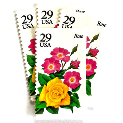 Image of Rose postage stamps from the 1994 Summer Garden Flowers series, featuring a yellow rose with pink blossoms and green foliage on vintage unused 29-cent USPS postage, Scott 2833