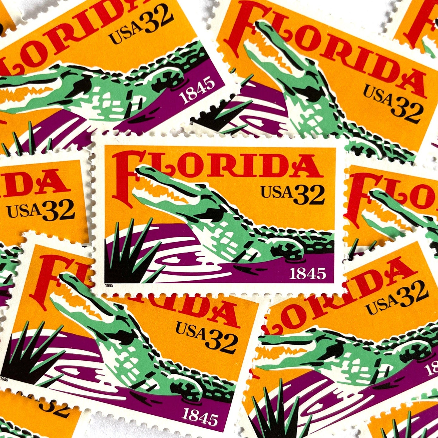 Image of Florida Statehood postage stamps from 1995, featuring an American Alligator in the Everglades and tropical Florida scenery on vintage unused 32-cent USPS postage, Scott 2950.