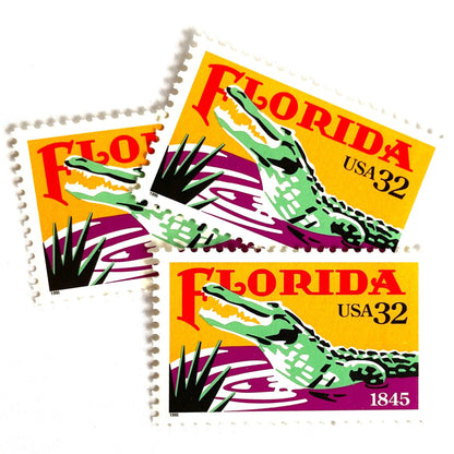 Image of Florida Statehood postage stamps from 1995, featuring an American Alligator in the Everglades and tropical Florida scenery on vintage unused 32-cent USPS postage, Scott 2950.