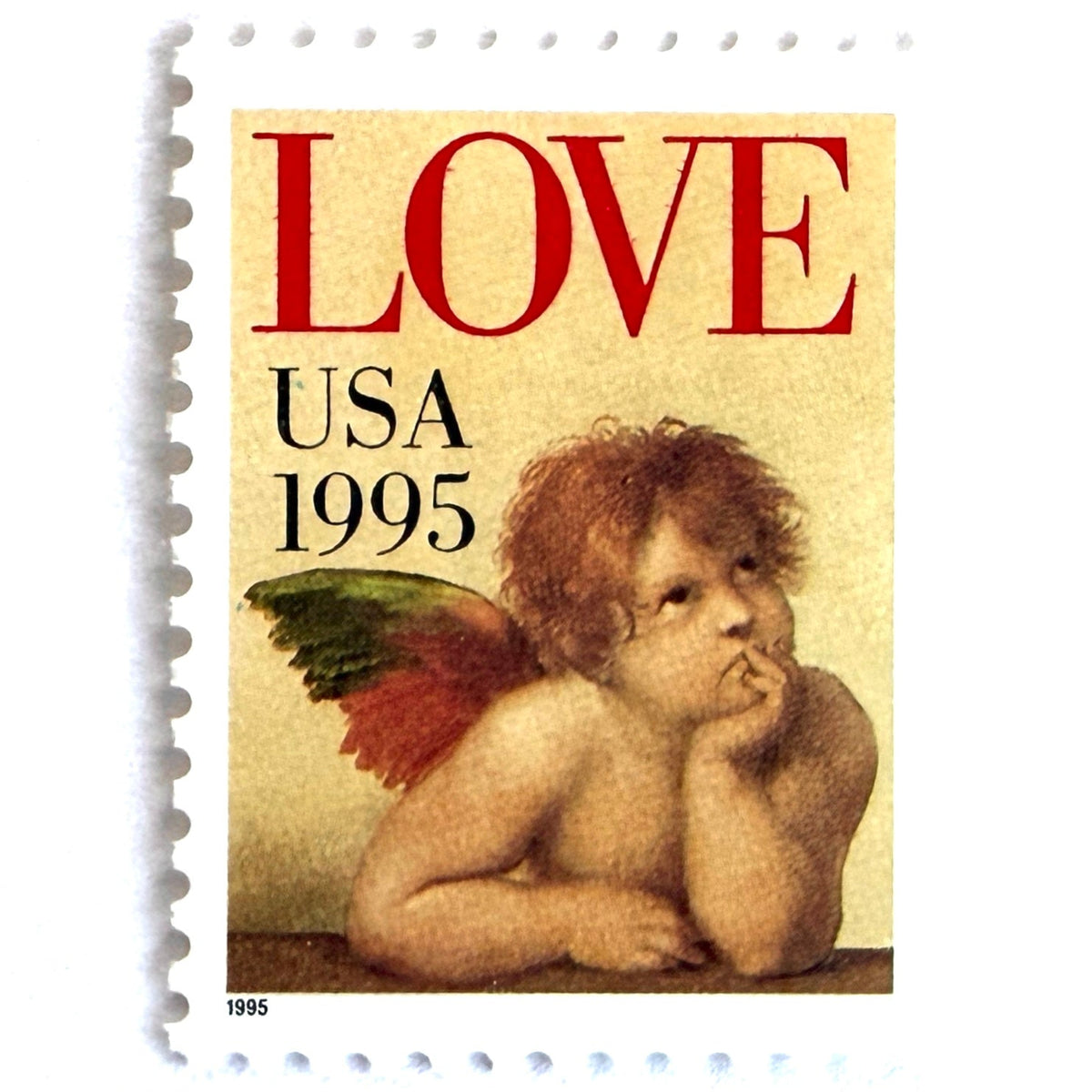 Cherub postage stamp from 1995 featuring Raphael’s contemplative cherub from the Sistine Madonna on vintage unused 32-cent USPS postage, Scott 2959.