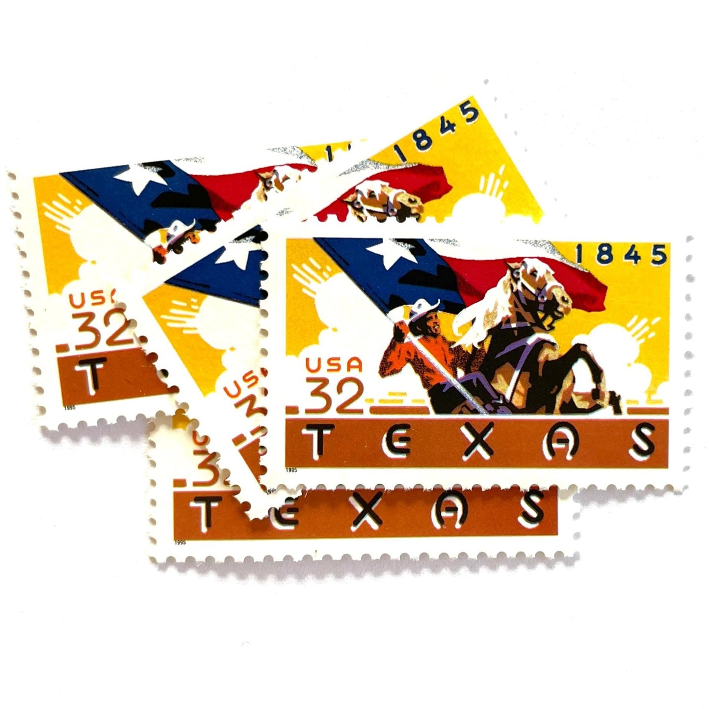 Image of Texas Statehood postage stamps from 1995, featuring a cowboy on horseback waving the Texas State flag on vintage unused 32-cent USPS postage, Scott 2968.