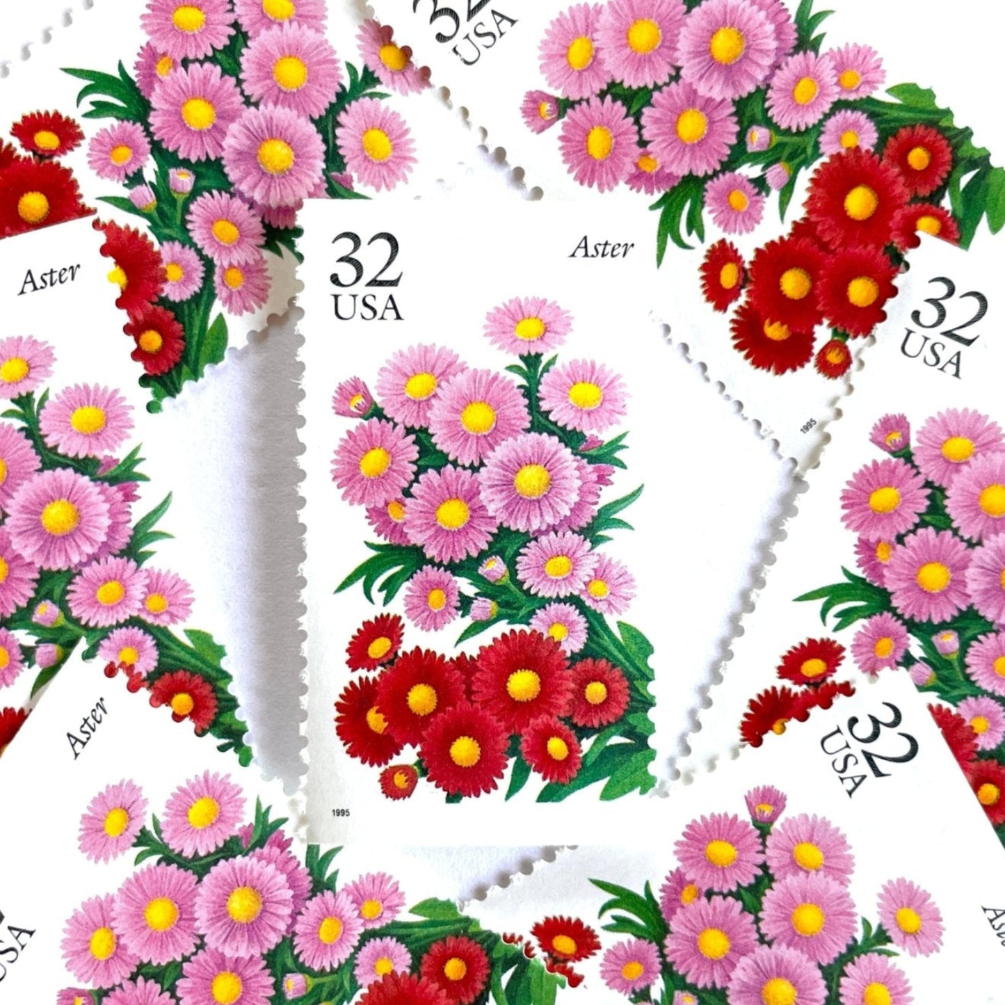 Image of 1995 Garden Flowers series “The Fall Garden: Aster” unused 32-cent vintage USPS mail stamps. Scott #2993. Stamp Themes: Flowers, Floral, Botanical, Fragrant, Gardening, Fall, Autumn, Nature. Pink, Red, Green, Multicolored gummed postage stamp. Perfect postage stamp to use for save the date announcements, wedding invitation postage, bridal shower invitations, birth announcements, thank you cards, valentine’s day, and snail mail.