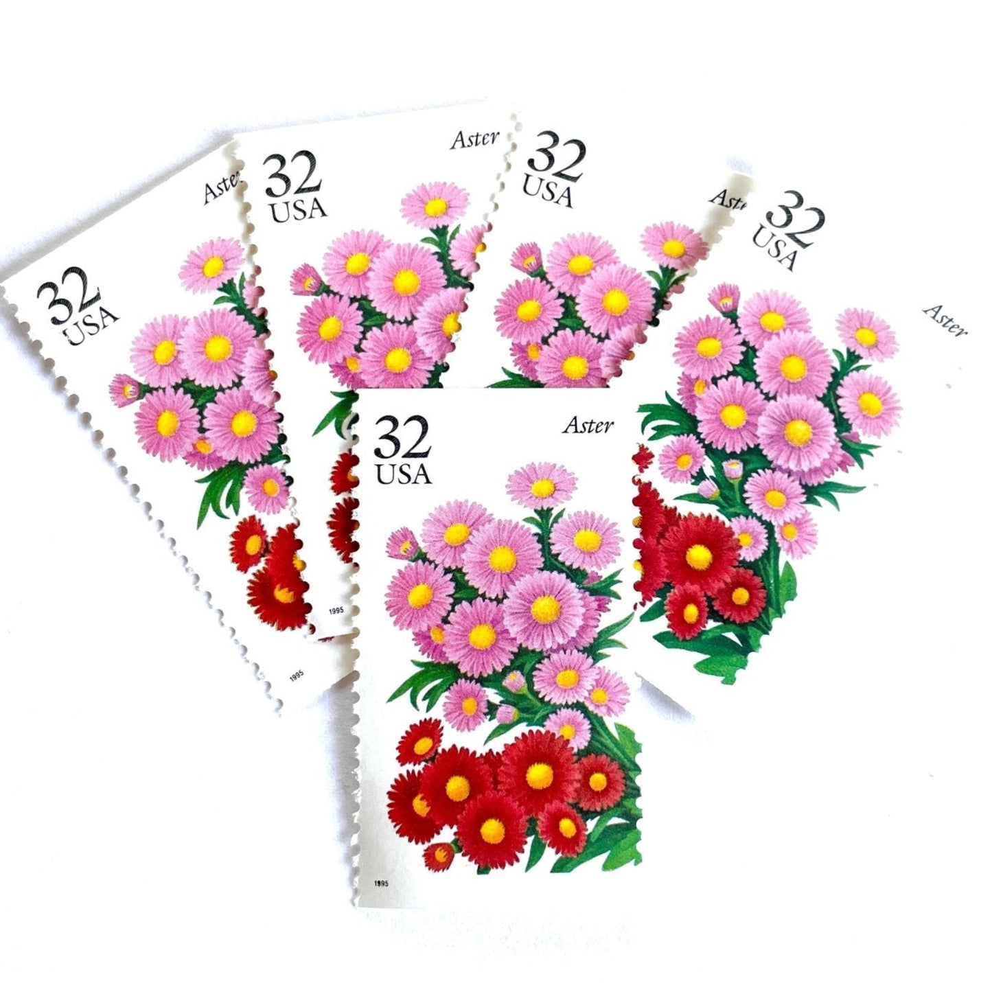 Image of 1995 Garden Flowers series “The Fall Garden: Aster” unused 32-cent vintage USPS mail stamps. Scott #2993. Stamp Themes: Flowers, Floral, Botanical, Fragrant, Gardening, Fall, Autumn, Nature. Pink, Red, Green, Multicolored gummed postage stamp. Perfect postage stamp to use for save the date announcements, wedding invitation postage, bridal shower invitations, birth announcements, thank you cards, valentine’s day, and snail mail.
