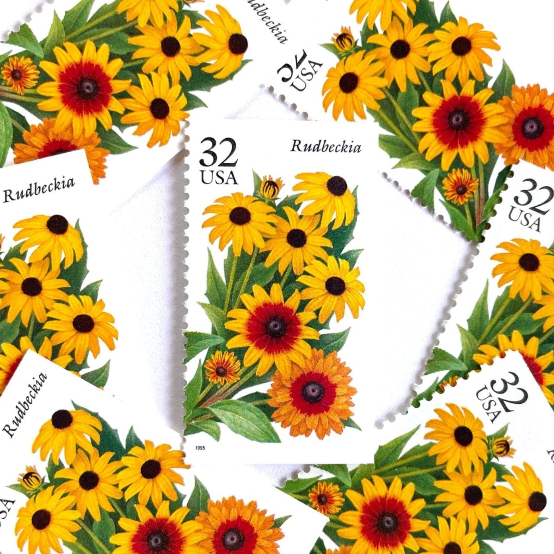 Image of 1995 Garden Flowers series “The Fall Garden: Rudbeckia” aka “Black-eyed Susan” unused 32-cent vintage USPS mail stamps. Scott #2997. Stamp Themes: Flowers, Wildflowers, Floral, Botanical, Fragrant. Yellow, Orange, Green, Multicolored gummed postage stamp. Perfect postage stamp to use for save the date announcements, wedding invitation postage, bridal shower invitations, birth announcements, thank you cards, valentine’s day, and snail mail.