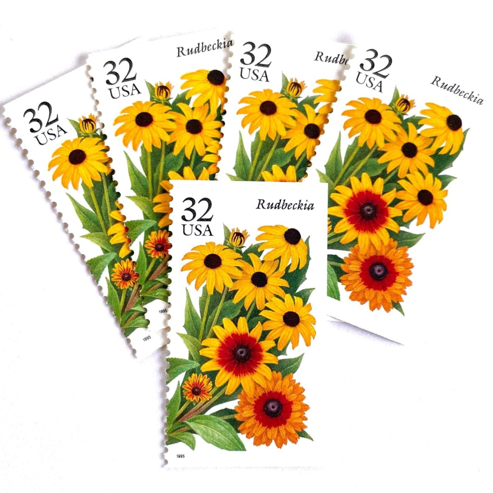 Image of 1995 Garden Flowers series “The Fall Garden: Rudbeckia” aka “Black-eyed Susan” unused 32-cent vintage USPS mail stamps. Scott #2997. Stamp Themes: Flowers, Wildflowers, Floral, Botanical, Fragrant. Yellow, Orange, Green, Multicolored gummed postage stamp. Perfect postage stamp to use for save the date announcements, wedding invitation postage, bridal shower invitations, birth announcements, thank you cards, valentine’s day, and snail mail.