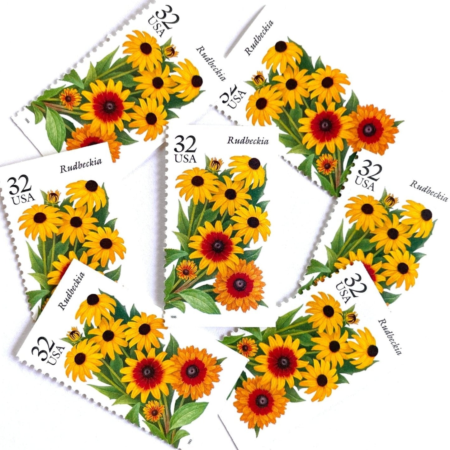 Image of 1995 Garden Flowers series “The Fall Garden: Rudbeckia” aka “Black-eyed Susan” unused 32-cent vintage USPS mail stamps. Scott #2997. Stamp Themes: Flowers, Wildflowers, Floral, Botanical, Fragrant. Yellow, Orange, Green, Multicolored gummed postage stamp. Perfect postage stamp to use for save the date announcements, wedding invitation postage, bridal shower invitations, birth announcements, thank you cards, valentine’s day, and snail mail.