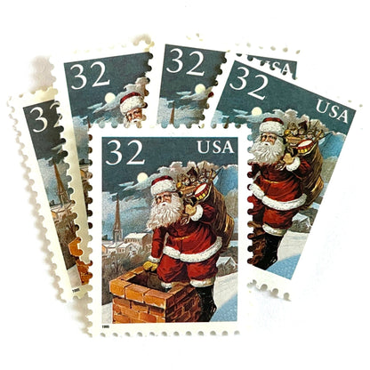 Image of 32-cent Contemporary Christmas 1995 Santa and Children “Santa & Chimney” USPS postage stamps featuring Santa Claus on a rooftop entering a chimney, dressed in his traditional red suit with white trim and a fur-lined hat, depicted with a long white beard and a sack full of toys slung over his shoulder. Scott #3004. Stamp themes: Christmas, holidays, winter, Santa Claus, toys, gifts, winter wedding, winter save-the-date. Red and blue postage stamp.