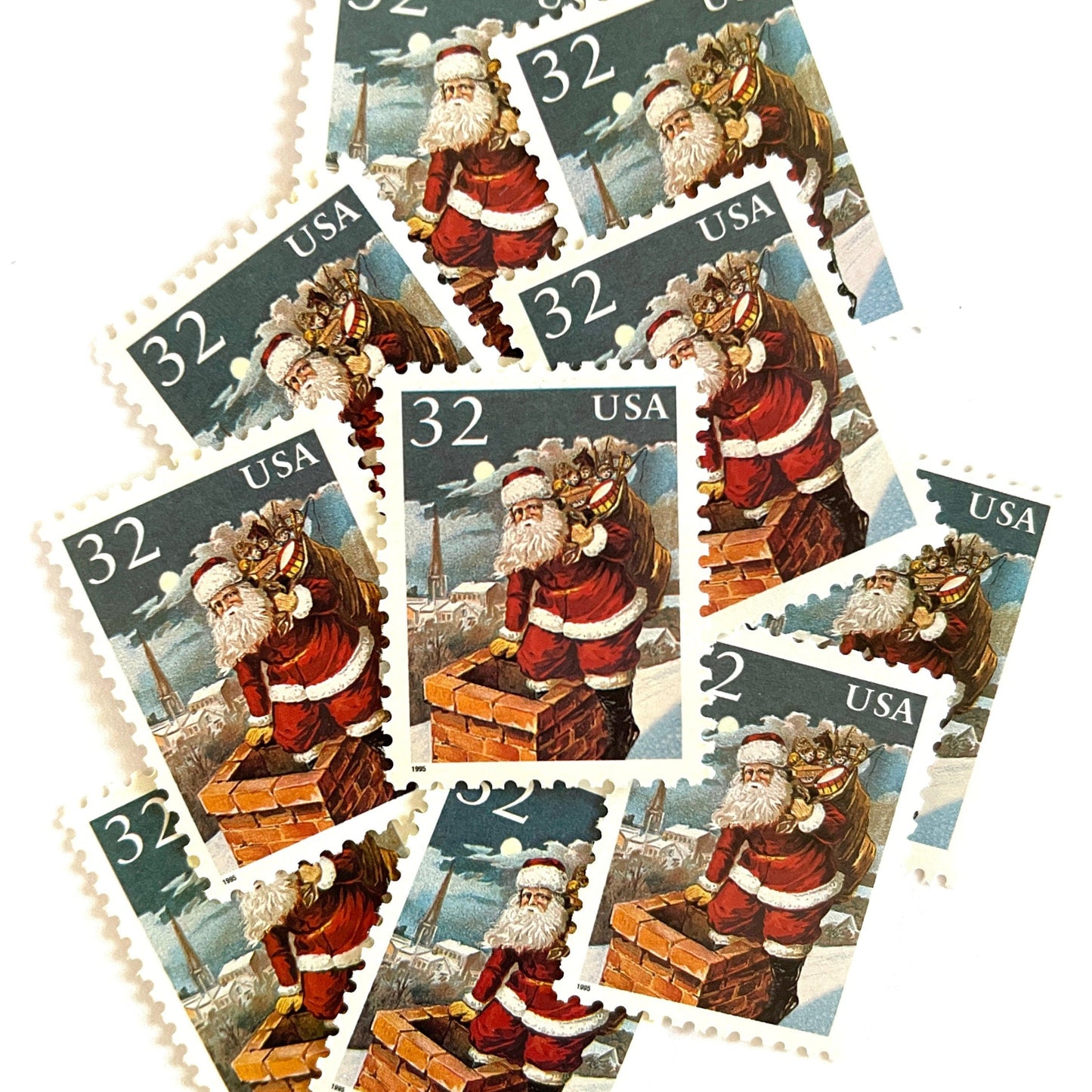 Image of 32-cent Contemporary Christmas 1995 Santa and Children “Santa & Chimney” USPS postage stamps featuring Santa Claus on a rooftop entering a chimney, dressed in his traditional red suit with white trim and a fur-lined hat, depicted with a long white beard and a sack full of toys slung over his shoulder. Scott #3004. Stamp themes: Christmas, holidays, winter, Santa Claus, toys, gifts, winter wedding, winter save-the-date. Red and blue postage stamp.