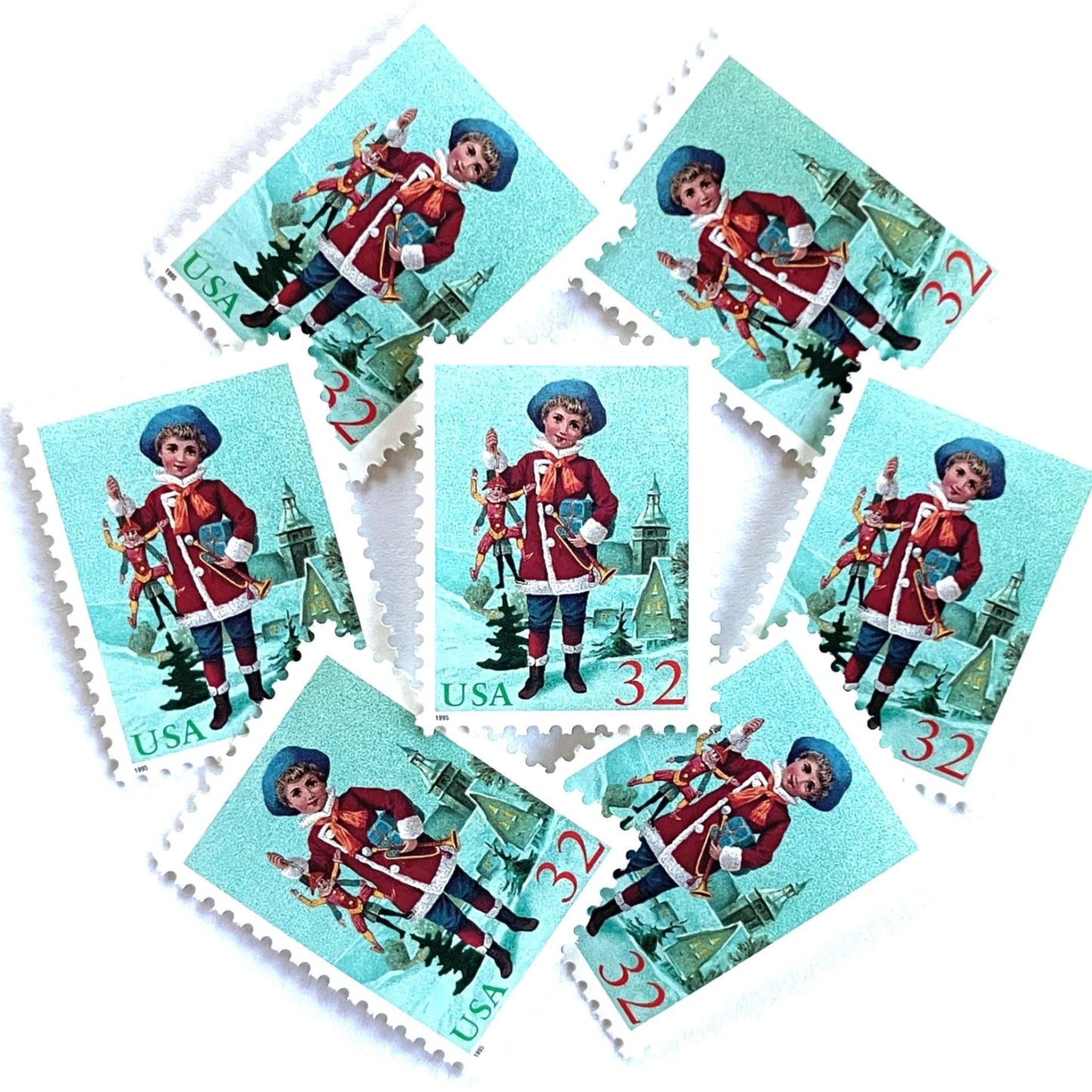 Image of 32-cent Contemporary Christmas 1995 Santa and Children “Child with Jumping Jack” USPS postage stamps featuring a young boy with blond, curly hair and a blue cap, dressed in a festive red coat with white fur trim, holding a traditional wooden jumping jack toy in one hand and a golden trumpet in the other. Scott #3005. Stamp themes: Christmas, holidays, winter, Santa Claus, toys, gifts, winter wedding, winter save-the-date. Green and red postage stamp.