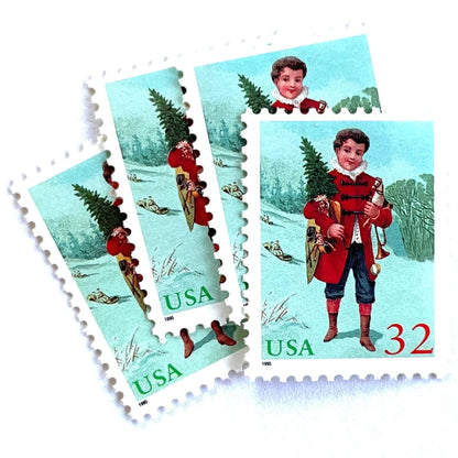 Image of 32-cent Contemporary Christmas 1995 Santa and Children “Child with Tree” USPS postage stamps featuring a boy in a red coat with dark buttons and blue trousers, wearing a ruffled white collar, stands facing forward, holding a small Christmas tree in his left arm and a toy trumpet in his right hand. Scott #3006. Stamp themes: Christmas, holidays, winter, toys, gifts, winter wedding, winter save-the-date. Green and red postage stamp.