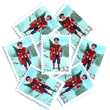 Image of 32-cent Contemporary Christmas 1995 Santa and Children “Child with Tree” USPS postage stamps featuring a boy in a red coat with dark buttons and blue trousers, wearing a ruffled white collar, stands facing forward, holding a small Christmas tree in his left arm and a toy trumpet in his right hand. Scott #3006. Stamp themes: Christmas, holidays, winter, toys, gifts, winter wedding, winter save-the-date. Green and red postage stamp.
