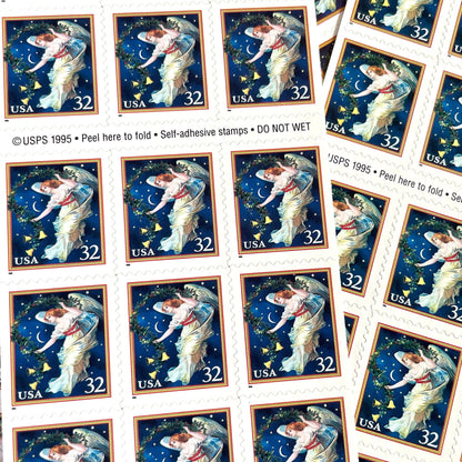 Image of 1995 Christmas “Midnight Angel” 32-cent stamps. Scott #3012. Stamp Themes: Christmas, Holidays, Angel, Celestial, Heavens, Bells, Night Sky, Victorian Christmas. Blue postage stamp.