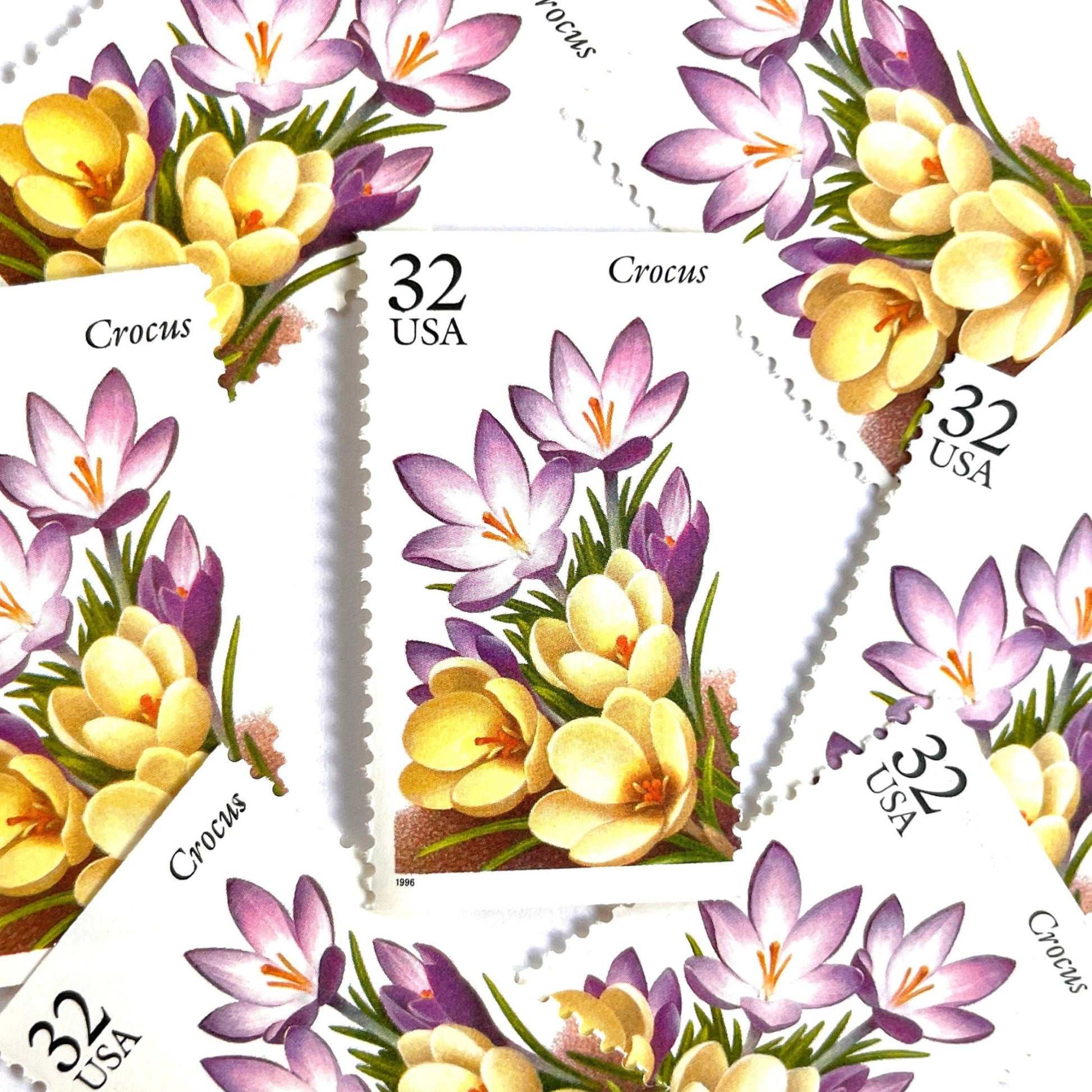 Image of vintage unused USPS Crocus postage stamps from the 1996 Winter Garden Flowers series, featuring a purple crocus flower with green foliage, 32-cent face value, Scott 3025.