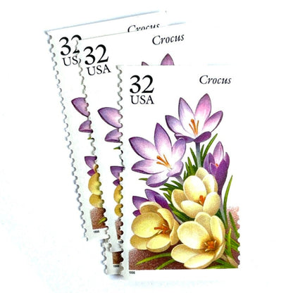 Image of vintage unused USPS Crocus postage stamps from the 1996 Winter Garden Flowers series, featuring a purple crocus flower with green foliage, 32-cent face value, Scott 3025.
