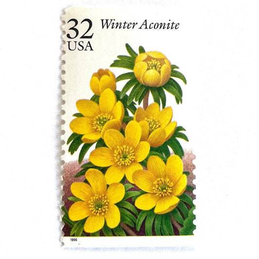 Image of vintage 1996 USPS Winter Aconite postage stamps from the Winter Garden Flowers series, featuring yellow flowers with green foliage and brown garden soil, 32-cent face value, Scott Number 3026.