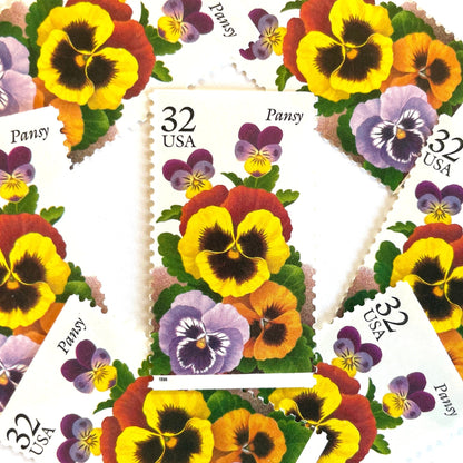 1996 32c Winter Garden Flowers Pansy USPS postage stamp, Scott 3027, featuring a purple and yellow pansy with green leaves from the Garden Flowers series.