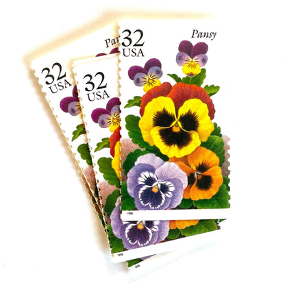 1996 32c Winter Garden Flowers Pansy USPS postage stamp, Scott 3027, featuring a purple and yellow pansy with green leaves from the Garden Flowers series.