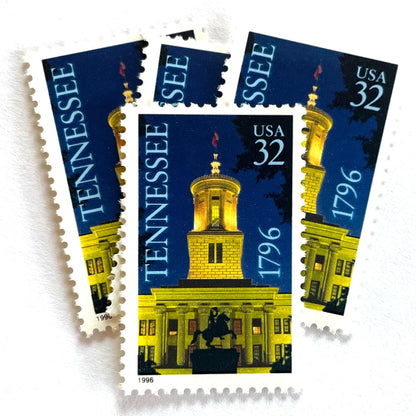 Image of Tennessee Statehood postage stamps from 1996, featuring the Tennessee State Capitol at night with an Andrew Jackson statue silhouette on vintage unused 32-cent USPS postage, Scott 3070.