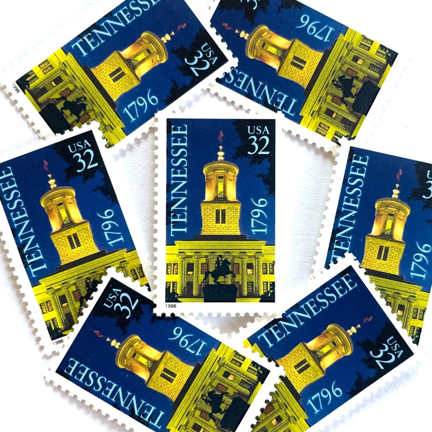 Image of Tennessee Statehood postage stamps from 1996, featuring the Tennessee State Capitol at night with an Andrew Jackson statue silhouette on vintage unused 32-cent USPS postage, Scott 3070.