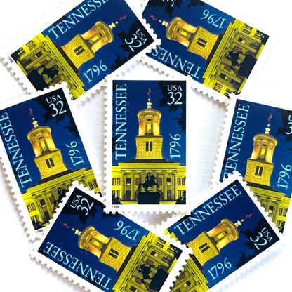 Image of Tennessee Statehood postage stamps from 1996, featuring the Tennessee State Capitol at night with an Andrew Jackson statue silhouette on vintage unused 32-cent USPS postage, Scott 3070.