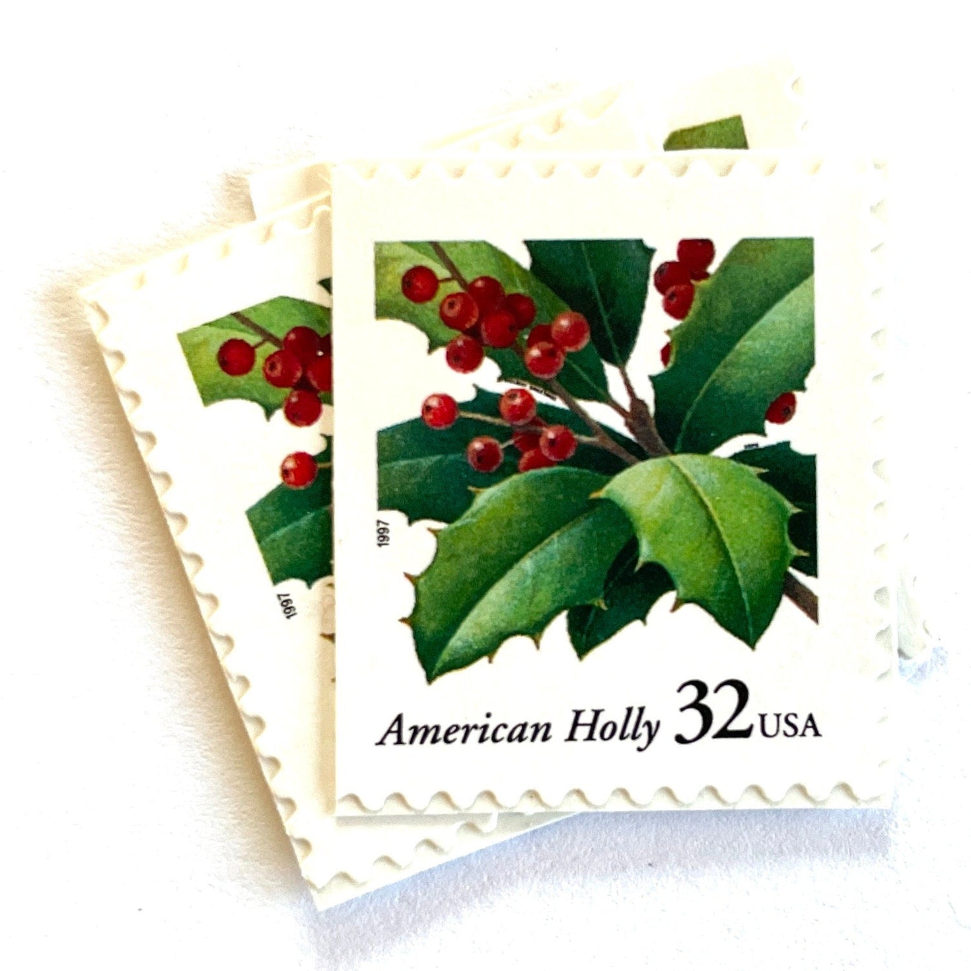 Image of 1997 Contemporary Christmas “American Holly” 32-cent stamps. Scott #3177. Stamp Themes: Holly, Red Berries, Christmas, Holidays, Winter, Evergreen. Green and red postage stamp.