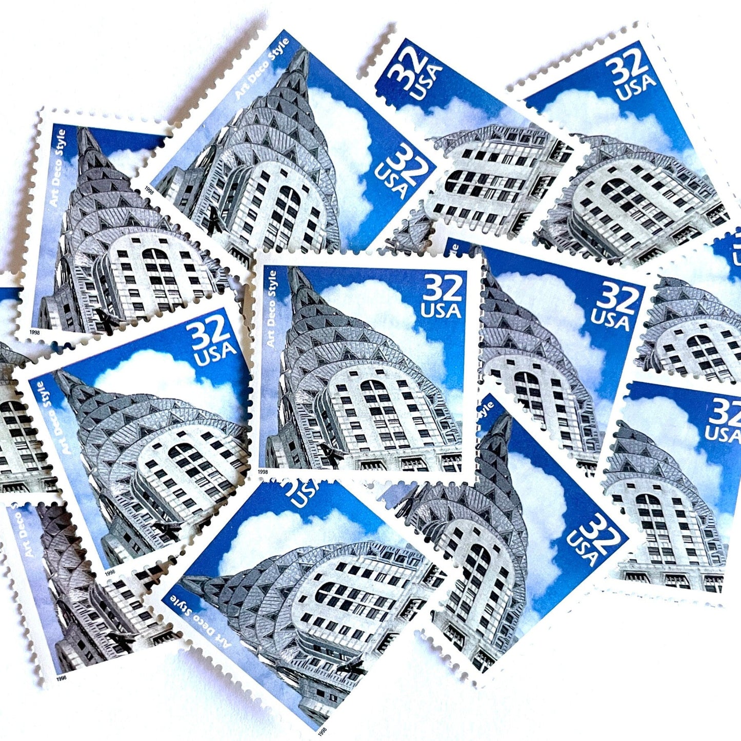 Image of 1998 Celebrate the Century - 1920s “Art Deco” 32-cent mail stamps. Scott #3184j. Stamp Themes: Art Deco Style, Chrysler Building, NYC, New York City. Blue and white postage stamp.