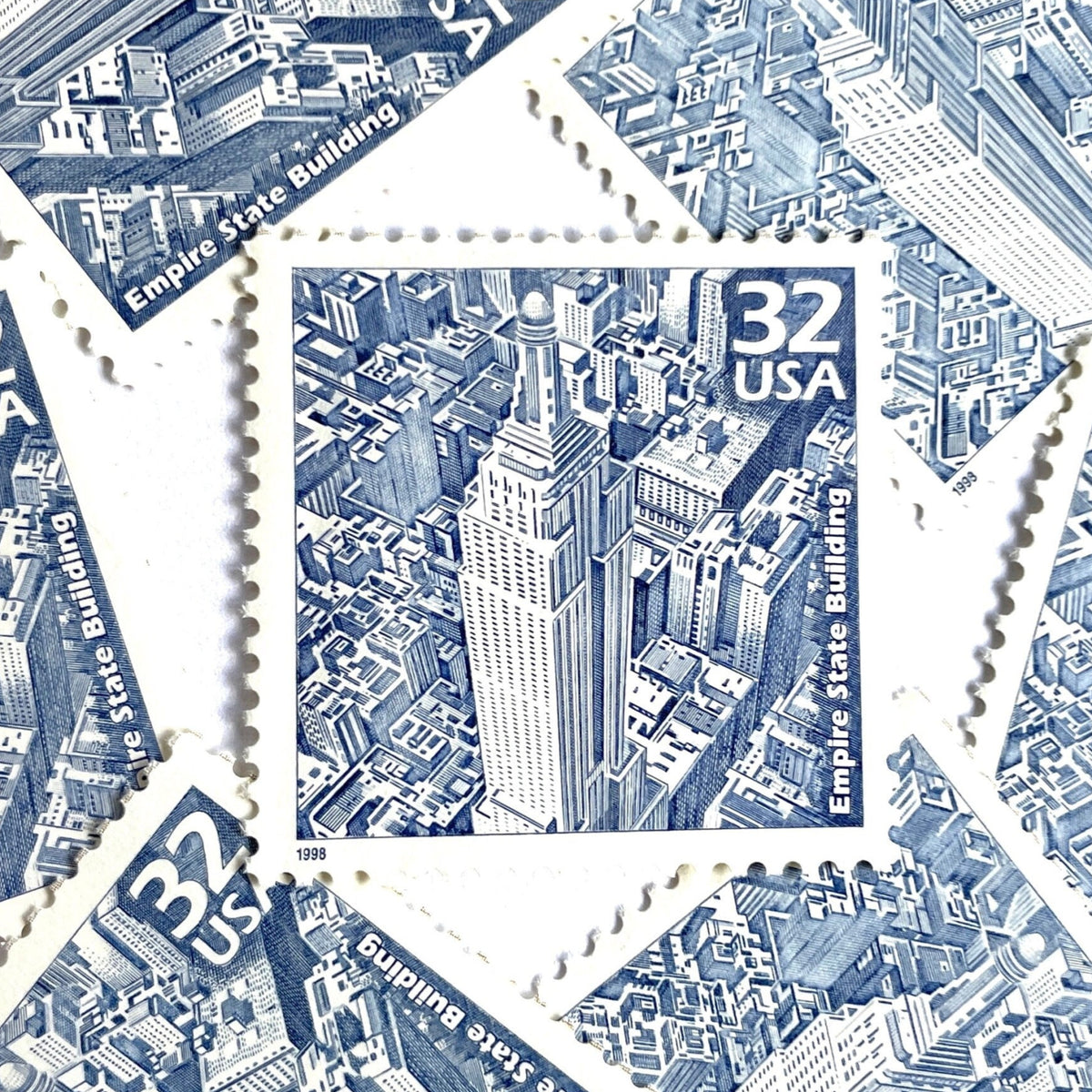Empire State Building postage stamps from 1998 featuring Paul Calle’s pencil-sketch illustration of the iconic New York City skyscraper on vintage unused 32-cent USPS postage, Scott 3185b.