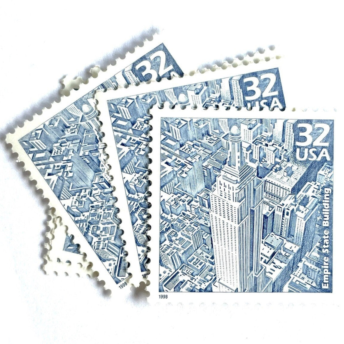 Empire State Building postage stamps from 1998 featuring Paul Calle’s pencil-sketch illustration of the iconic New York City skyscraper on vintage unused 32-cent USPS postage, Scott 3185b.