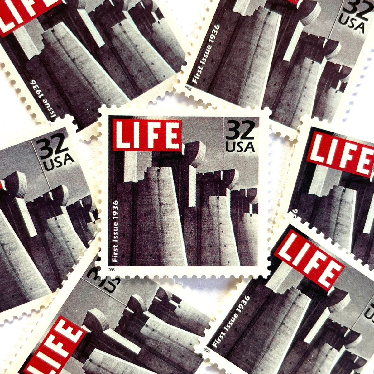 1st Issue LIFE Magazine postage stamps from 1998 featuring Margaret Bourke-White’s black-and-white photograph of Fort Peck Dam on the November 1936 debut cover of LIFE on vintage unused 32-cent USPS postage, Scott 3185c.