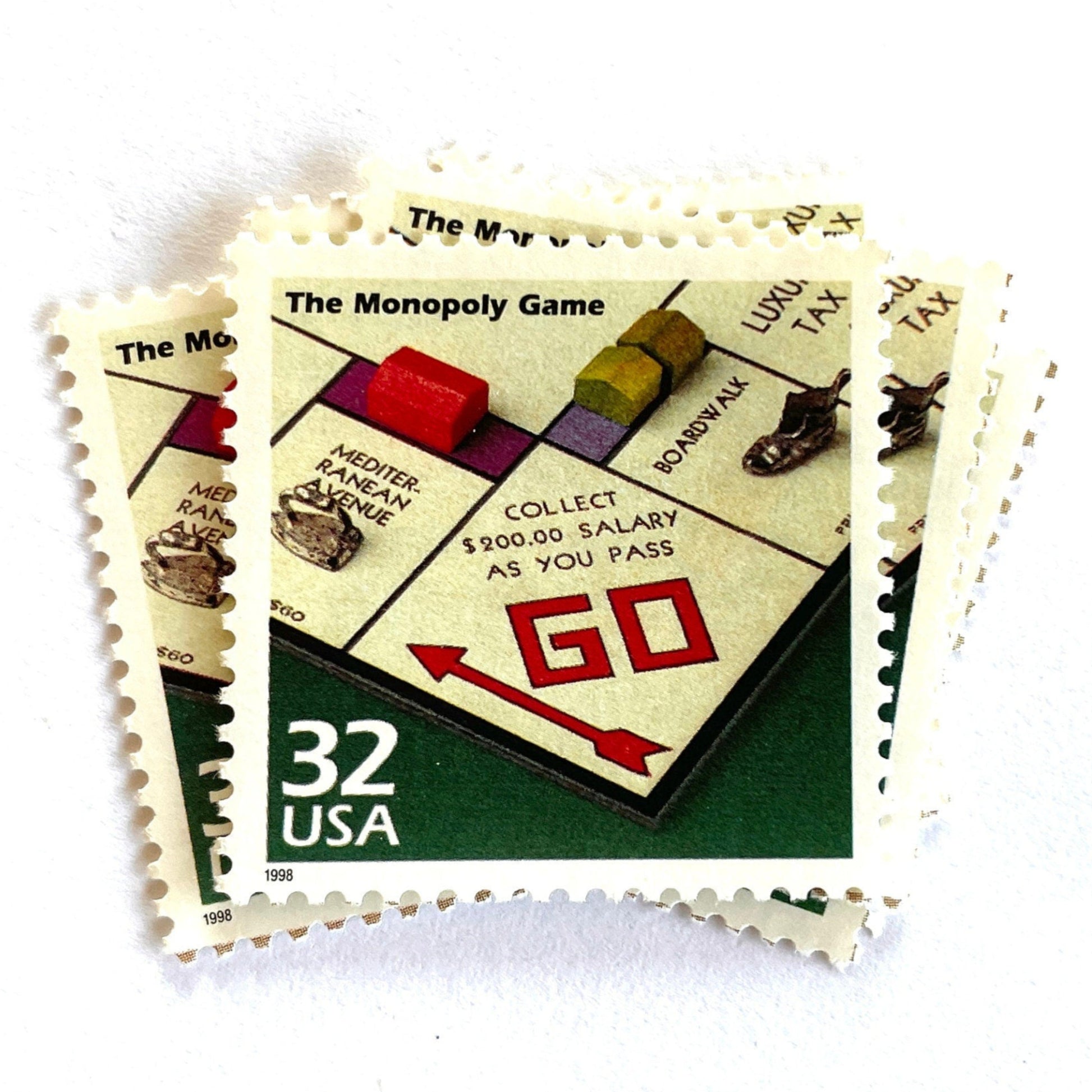 Image of 1998 Celebrate the Century — 1930s The Monopoly Game 32 cent stamps. Scott #3185o. Stamp themes: Board Games, Family Game Night, Gameplay, Pass GO, Get Out of Jail, Monopoly Money, Real Estate, Bankruptcy, Great Depression, Mortgage, Rent, Own it All.
