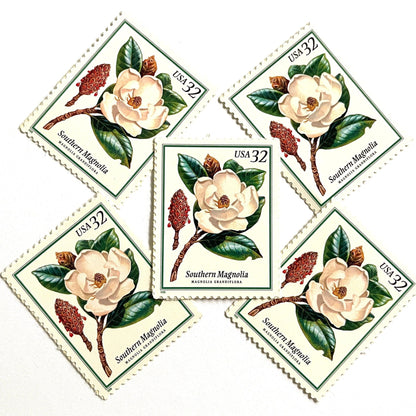 Southern Magnolia postage stamps from 1998 featuring large white magnolia blossoms and green foliage on vintage unused 32-cent USPS postage, Scott 3193.
