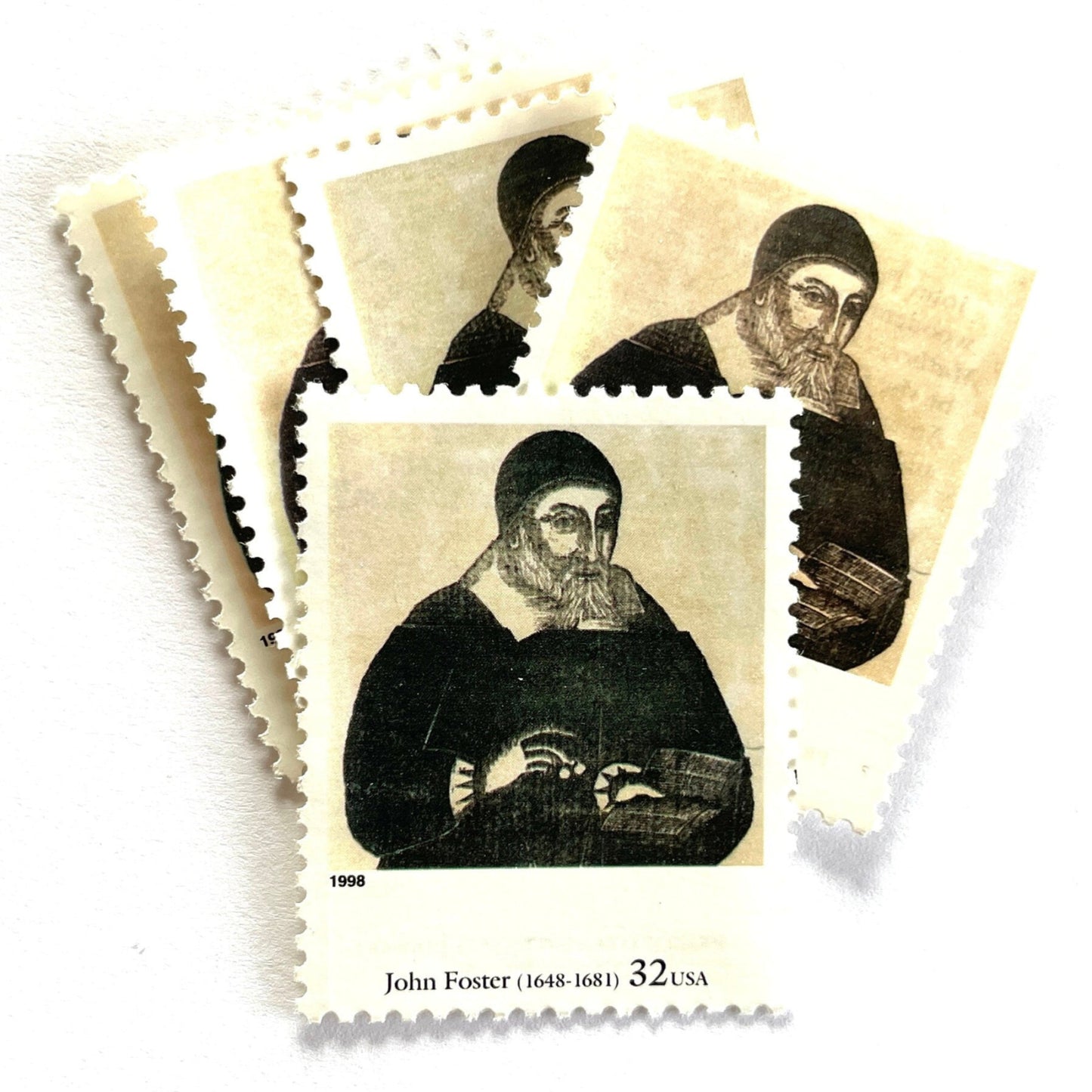John Foster’s “Portrait of Richard Mather” Postage Stamp from the 1998 Four Centuries of American Art Series. This stamp depicts the iconic engraving of a puritan minister. An iconic religious theme, this black and white postage stamp depicts a puritan minister and is often used to mail wedding invitations. These are vintage unused USPS postage stamps with a face value of 32 cents each. Scott number 3236A.