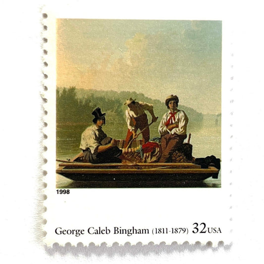 Close up image of George Caleb Bingham’s “Boatmen on the Missouri" Postage Stamp from the 1998 Four Centuries of American Art Series. This stamp depicts the iconic landscape painting of boatmen navigating the Missouri River. An iconic nature theme, this postage stamp depicts the three med rafting down the Missouri River. These are vintage unused USPS postage stamps with a face value of 32 cents each. Scott number 3236F.