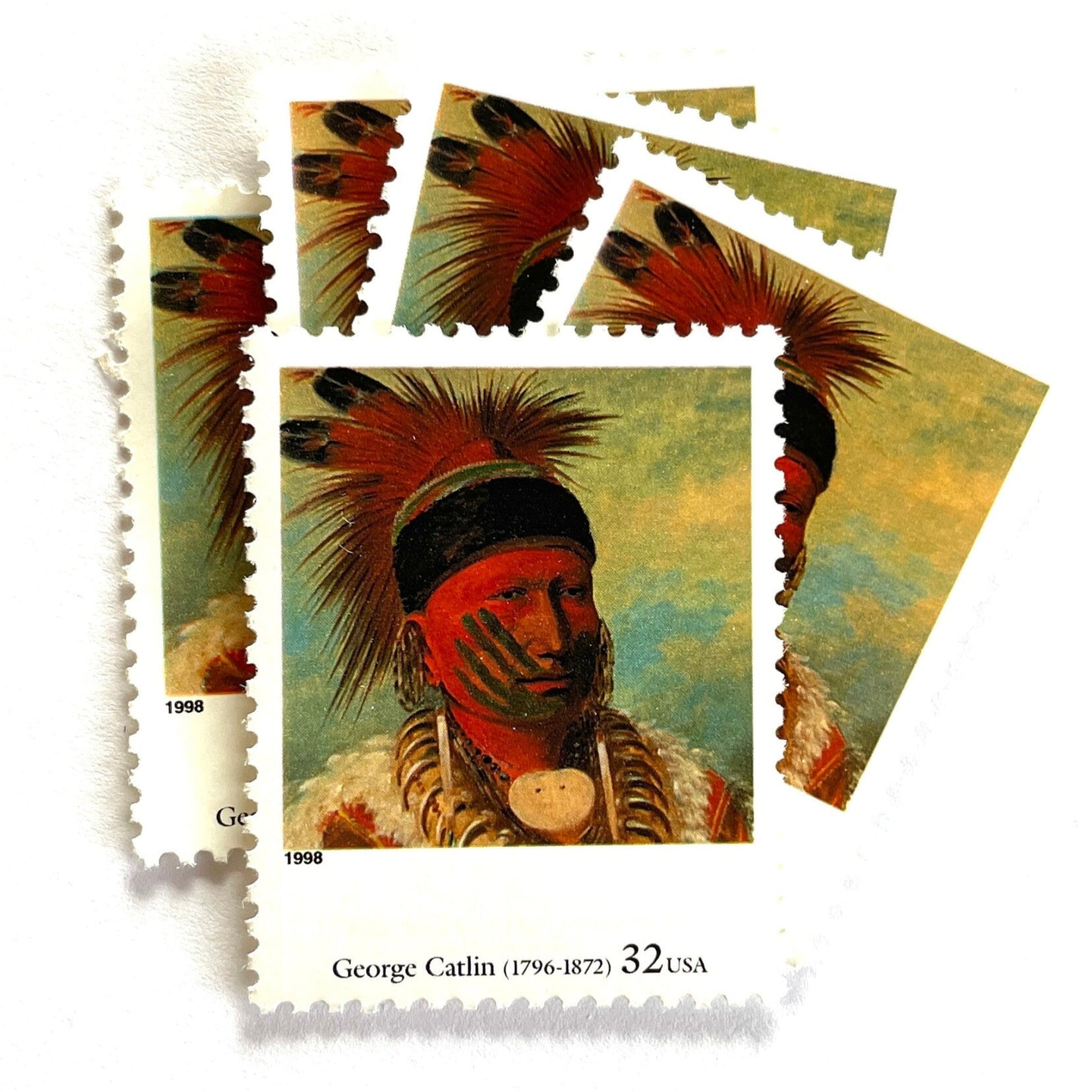 George Catlin’s “The White Cloud, Head Chief of the Iowas" Postage Stamp from the 1998 Four Centuries of American Art Series. This stamp depicts the iconic painting of Native American Indian Chief White Cloud in his ceremonial warpaint and feathers. An iconic western indigenous theme, this postage stamp depicts the pride and heritage of Native Americans. These are vintage unused USPS postage stamps with a face value of 32 cents each. Scott number 3236K.