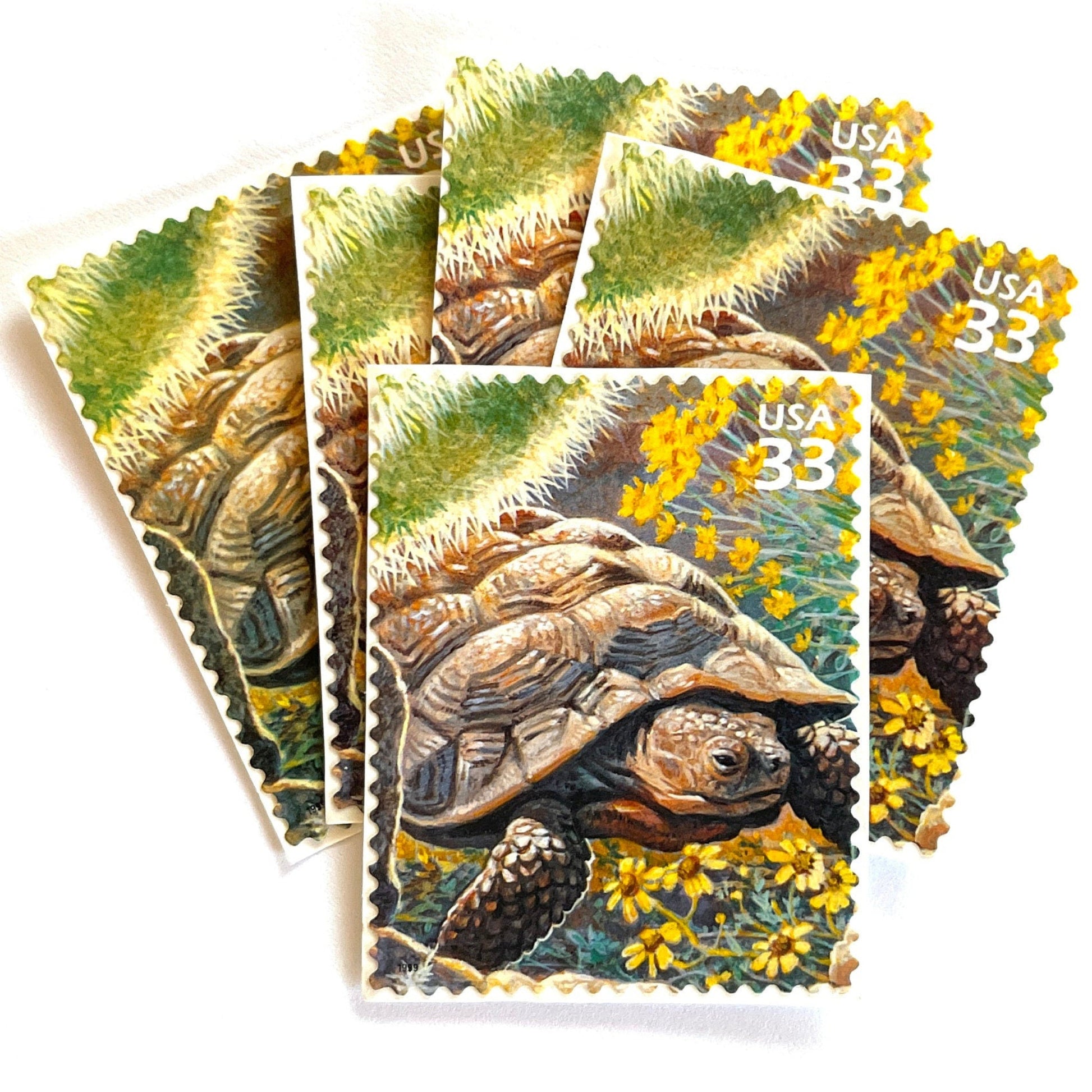 Image of Desert Tortoise postage stamps from the 1999 Nature of America Sonoran Desert issue, featuring a brown desert tortoise set in yellow flowers and cactus in a Southwestern landscape on vintage unused 33-cent USPS postage, Scott 3293b.
