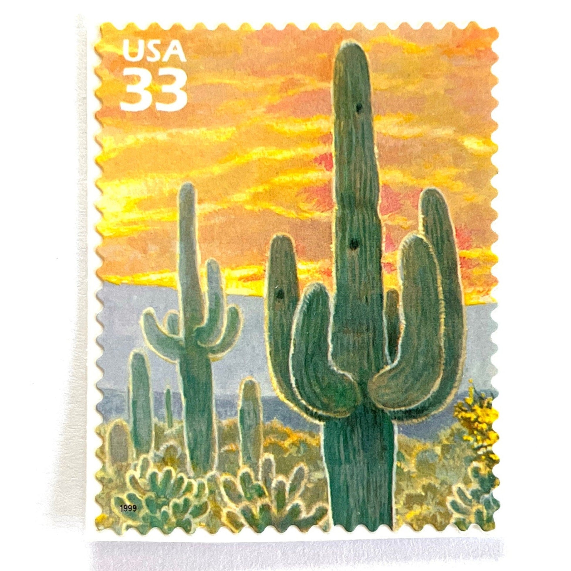 Image of Saguaro Cactus postage stamps from the 1999 Nature of America Sonoran Desert series, featuring a green saguaro cactus in a Southwestern desert landscape on vintage unused 33-cent USPS postage, Scott 3293e.
